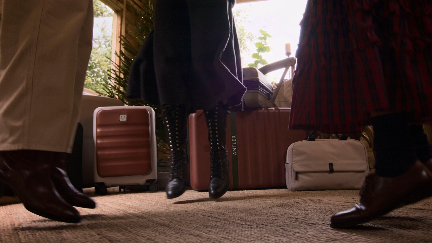 Antler Festive Campaign Film with friends arriving by car for Christmas with suitcases and bags