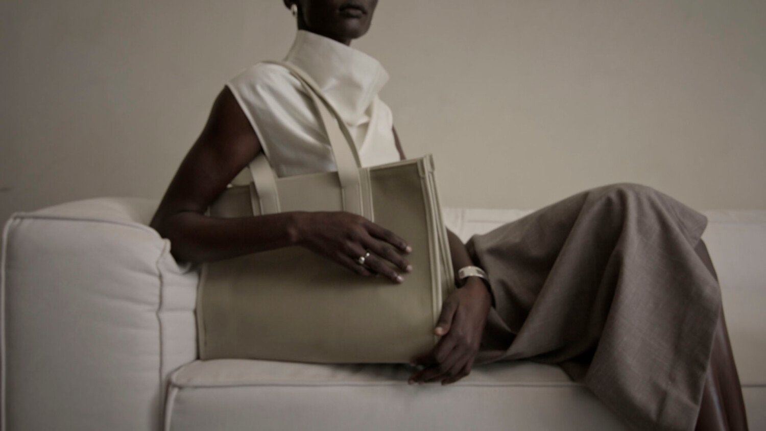 Antler Heritage Collection film with couple preparing for travel in modern house with suitcases and bags