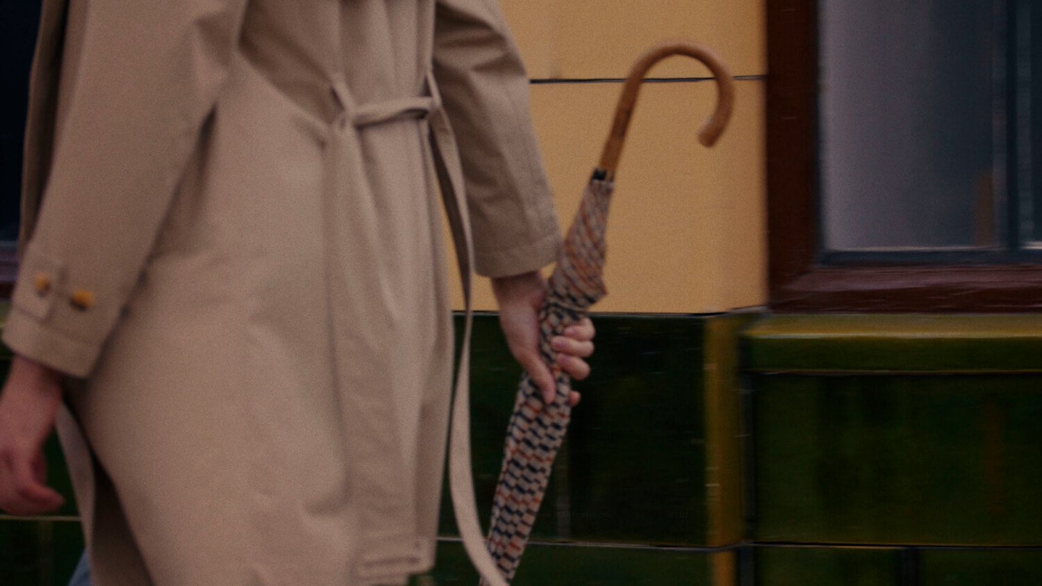 Daks trench coat film showing model in studio and craftsmanship in factory making the coat