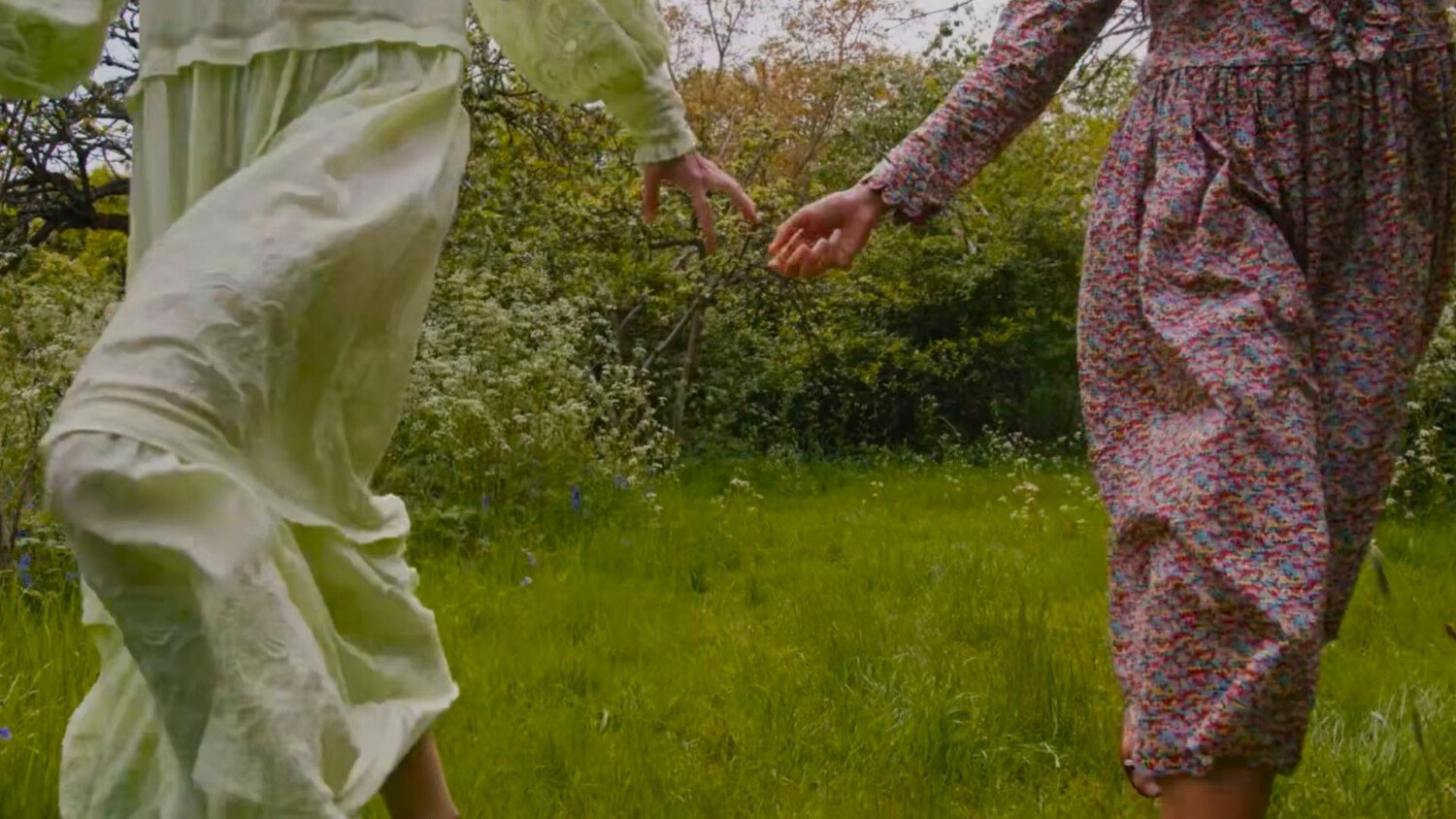 The Outnet Here Comes The Sun Film by Pedro Pacheco showing friends walking in nature through a countryside garden in spring summer